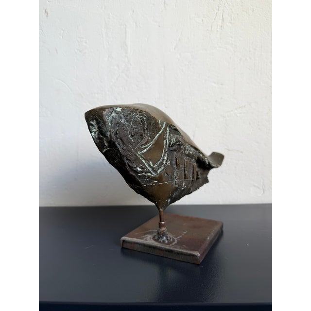 Fossilized fish sculpture made of solid bronze and mounted on a steel base. Brazil circa 1980s. Mário Agostinelli, signed.