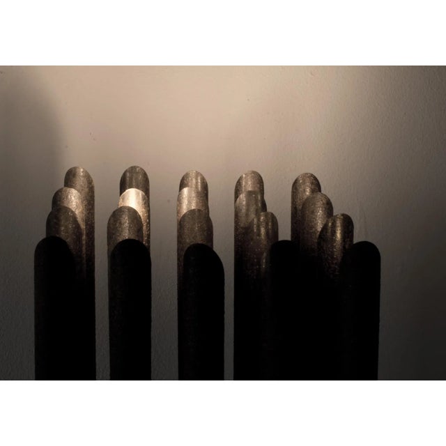 This light sculpture consists of 20 individually rotatable light thorns that are dimmable in two groups and can create a...