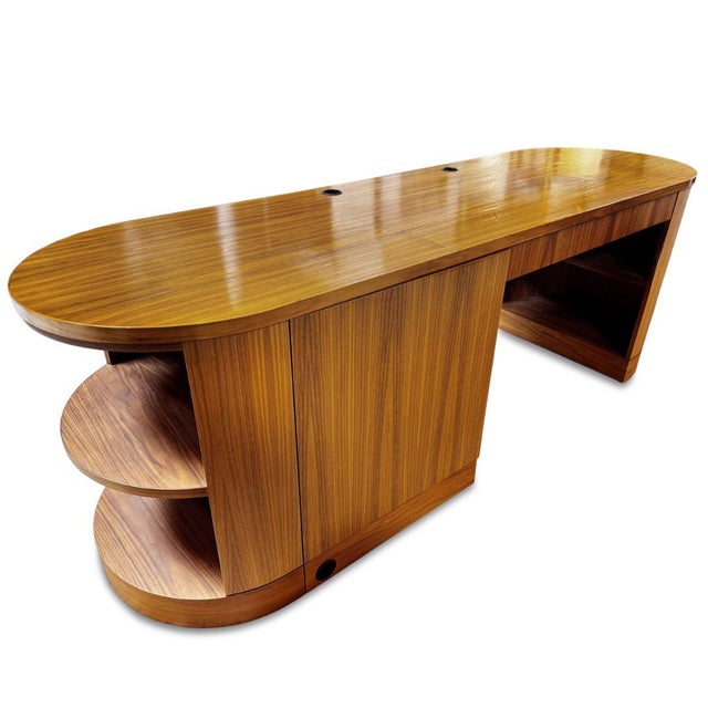 This Modern Oval Desk with Storage combines a streamlined silhouette with generous functionality, making it a distinctive...