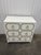 Offered is a vintage white and gold nightstand chest in the iconic style and manner of Dorothy Draper's Espana model....