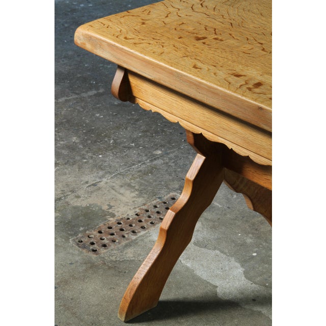 A small solid oak desk made in Denmark during the 1960s. The table has a strong character with a warm, almost rustic...