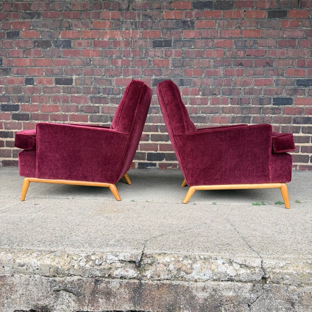 Beautifully restored pair of T.H. Robsjohn Gibbings lounge chairs. Reupholstered in maroon mohair.