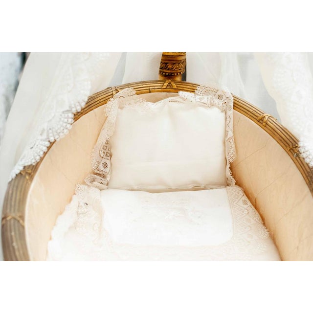 Bassinet or cradle made of carved and gilded wood in the French neoclassical taste of Louis XVI, in the Napoleon III era....