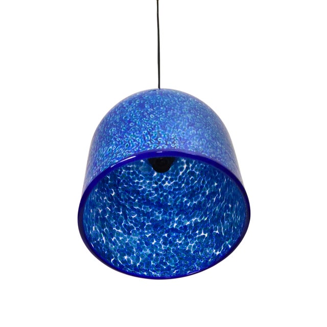 The ceiling lamp is a designer lamp designed by Gae Aulenti, "Neverino," produced by Vistosi, Murano, in the 1970s. Blown...