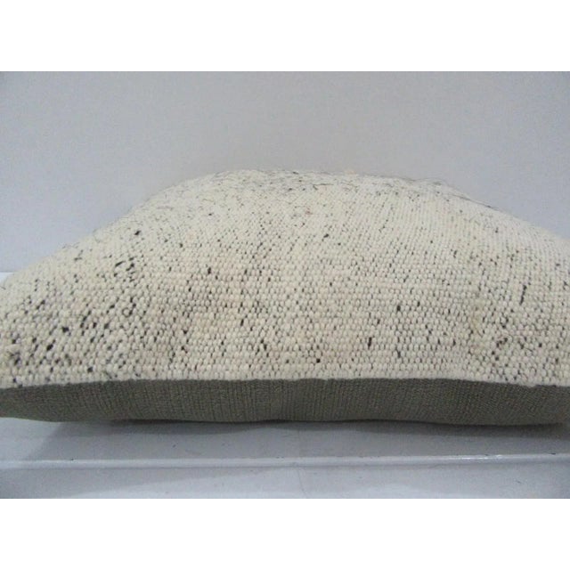 This is a pillow cover made from a vintage kilim rug. The piece was properly washed and ready to use. Pillow inserts not...