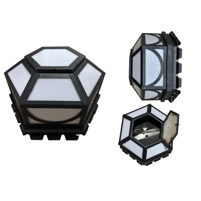 Add architectural character and warm ambient lighting to your space with this vintage black flush mount ceiling light....