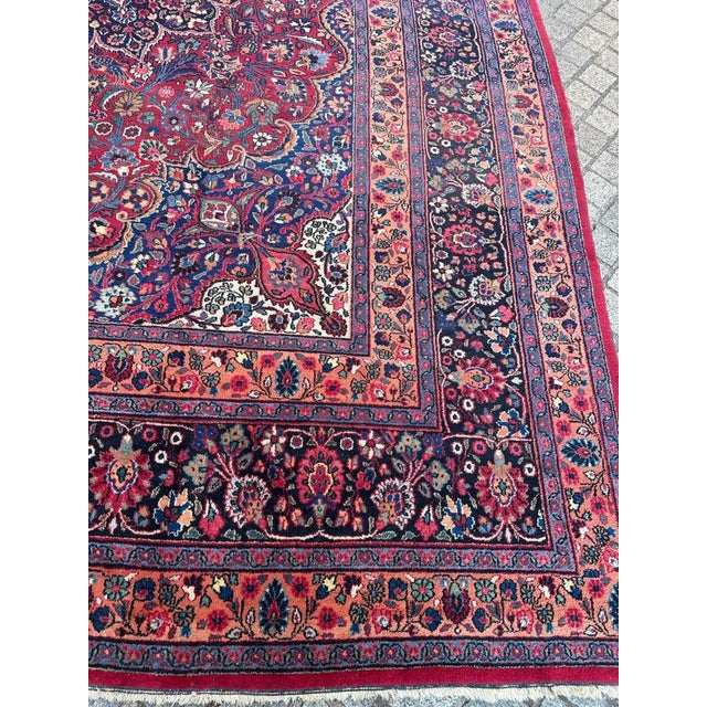 A stunning early 20th-century Dorokhsh rug, boasting a large size and exquisite features. This masterpiece showcases a...