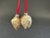These gold art glass fortune cookie ornaments will add a whimsical touch to your Christmas home decor. Attached by a red...