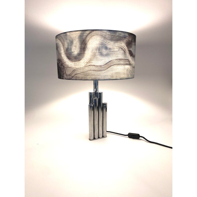A table lamp * In the Reggiani style (no manufacturer's mark) * Heavy, high-quality construction * Made of chrome-plated...