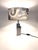 A table lamp * In the Reggiani style (no manufacturer's mark) * Heavy, high-quality construction * Made of chrome-plated...