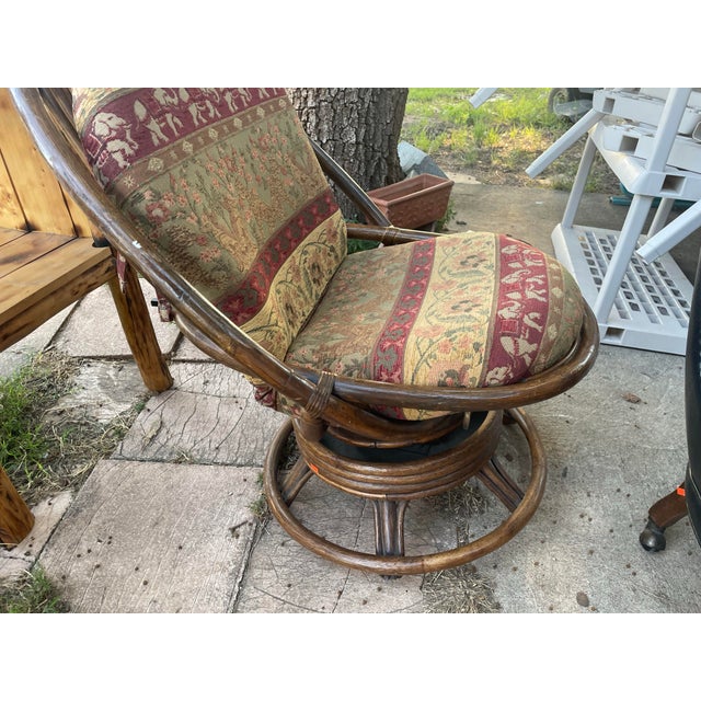 Mid century boho Chic Ratan swivel chair with pad. Sturdy construction. Comfortable pad. Great for living area, sunroom,...