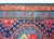 An incredible early 20th century Persian Kazak rug with three central medallions each with an endless knot pattern...