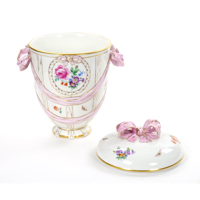 This elegant KPM porcelain covered centerpiece vase, made in Germany circa 1960, showcases the exceptional craftsmanship...