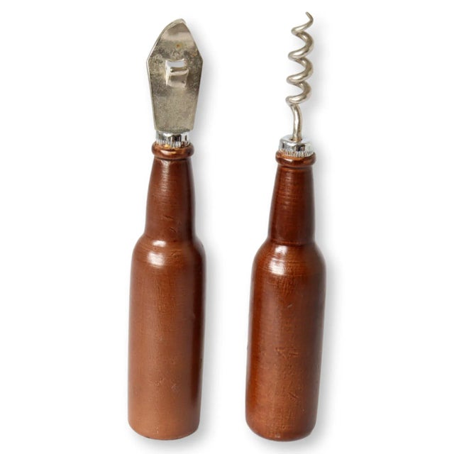 Raise a glass to this cheeky Guinness bar tool set, featuring a bottle opener and corkscrew cleverly disguised as vintage...