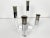 Vintage lucite and chrome candelabra with 4 varied height candlesticks. Year: 1970s Style: Mid Century Modern Dimensions:...