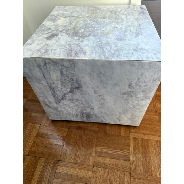 Sculptural, substantial, and effortlessly elegant. This marble plinth features soft grey veining that drifts across a...