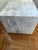 Sculptural, substantial, and effortlessly elegant. This marble plinth features soft grey veining that drifts across a...