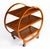 This is a striking antique Art Deco three-tier figured walnut hostess trolley dating from the 1920s. The trolley is of...