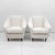 A pair of Italian armchairs produced in the 1950s. The armchairs have been completely restored and upholstered in cream-...