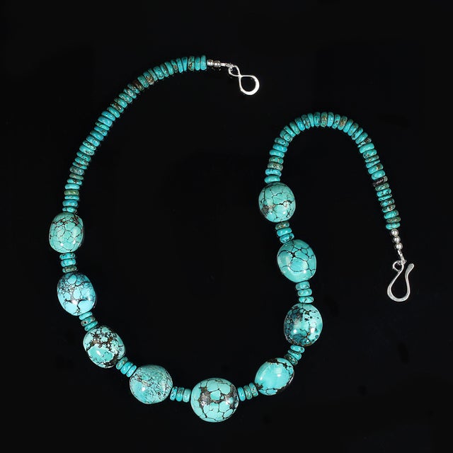 This striking 19‑inch necklace showcases natural emerald‑in‑matrix beads measuring approximately 9–10 mm, each one...