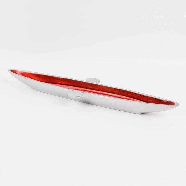 Striking modernist Space Age aluminum bowl or desk tidy or catchall. An elongated canoe-shaped piece in typical spatial...