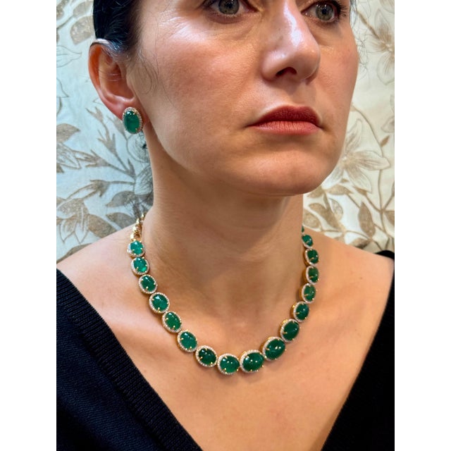 110 Ct Oval Natural Cabochon Emerald & Diamond Necklace Suite set in 14 Karat Yellow Gold is a stunning piece. This...