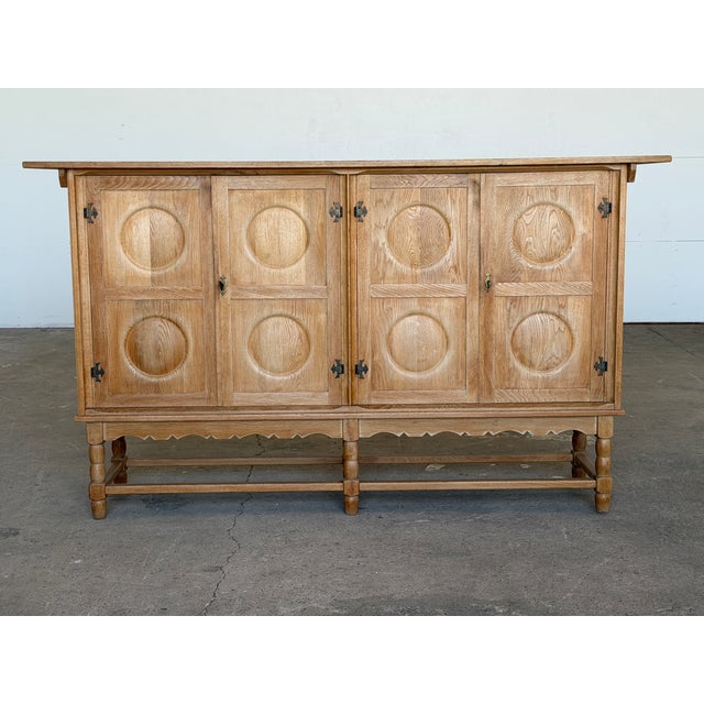 A Danish oak sideboard credenza produced by Otterup Møbelfabrik, stamped and dated 30 July 1965 on the reverse. The case...