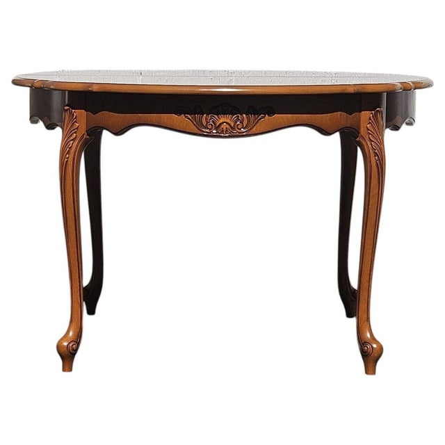 French Cherry wood Dining Table from the 80s. Exquisitely tradinional handcrafted - richly decorated Tabletop and...