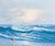 A luminous vintage coastal seascape oil painting depicting rolling ocean waves breaking along a rocky shoreline beneath a...