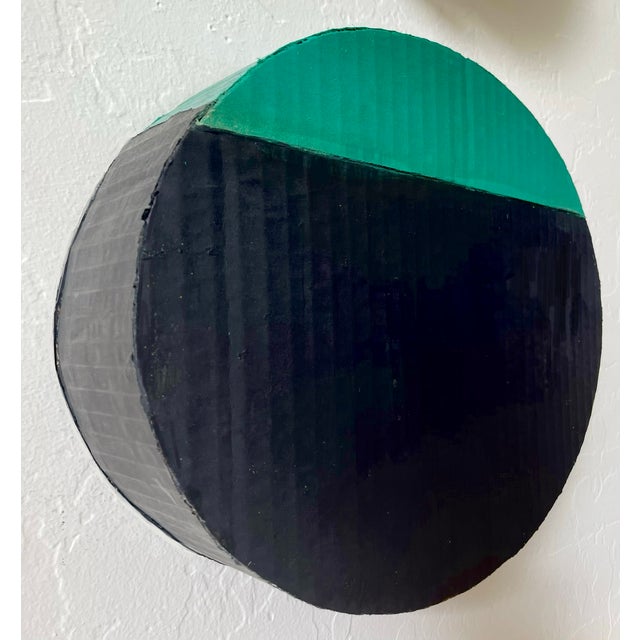 Add a 3D element to your contemporary space with a round disk in black and green. Designed to hang on wall alone or in...