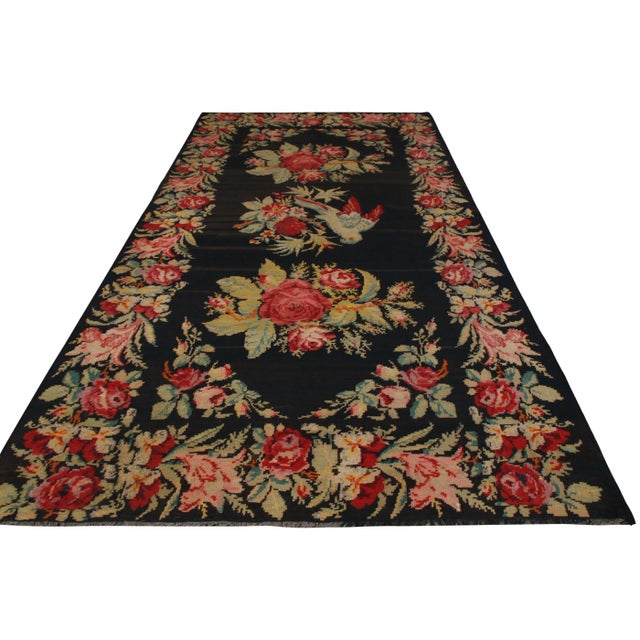 Originating circa 1950-1960 as a vintage Bessarabian flat-weave kilim, the style of this piece is distinctly Romanian, a...