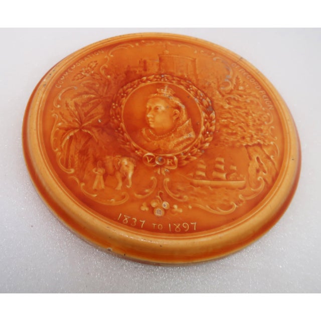 This antique Minton trivet or tile is quite rare. One occasionally sees one with the very large profile of the Queen, but...