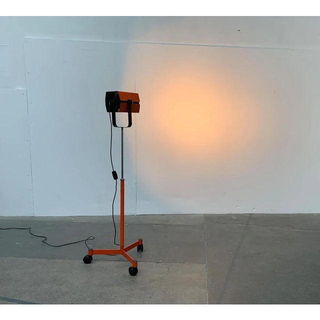 Mobile studio floor lamp from the swedish manufacturer alda. a technical design in the style of a studio spotlight. The...