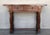 Early 20th century carved Spanish console with two drawers. This table with character is of rare narrow depth. It is...