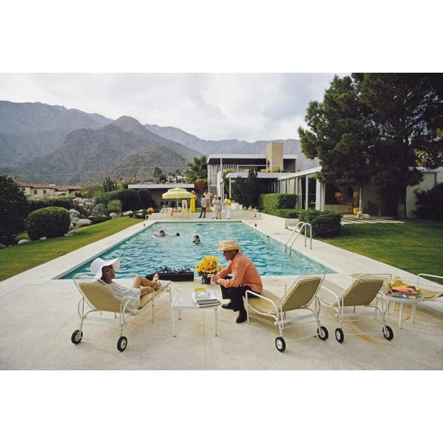Slim aarons estate limited edition c print 40 x 30'' inches unframed. ' kaufmann desert house ' lita baron talking with a...