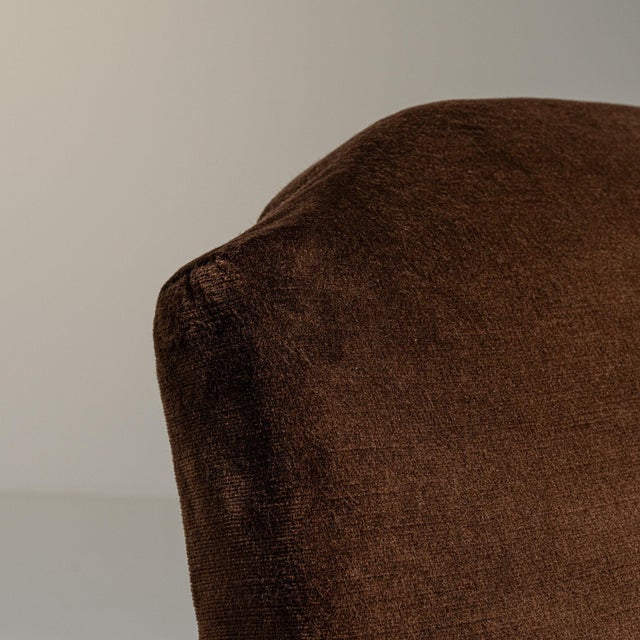 Upholstered wingback armchair in Deep Espresso Brown. Its deep espresso brown finish sets off rolled wing arms, turned...