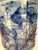 Bring timeless elegance to your home with this contemporary blue and white ceramic vase. Featuring an artistic floral...