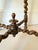 Antique English oak footstool featuring beautifully turned barley-twist legs, twisted stretchers, and a decorative center...