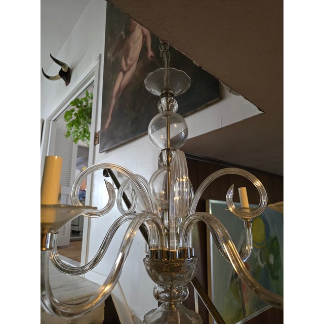A fine hand made Italian murano style chandelier in an understated sophisticated transparent neutral color. Very elaborate...