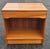 A 1970s Danish Modern Teak Bedside Table Nightstand. Measures 22" in width, 15" in depth and 21.75" in height.