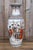 A striking Chinese porcelain vase combining famille rose enamels with sophisticated grisaille and iron-red decoration,...