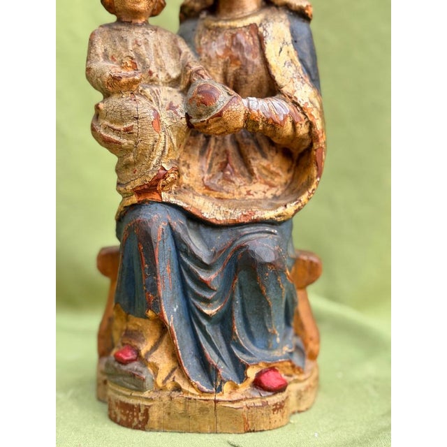 Seated Virgin and Child, both crowned, polychrome wood carving, Spanish school, ca. 1780 33cm high, 13cm wide This...