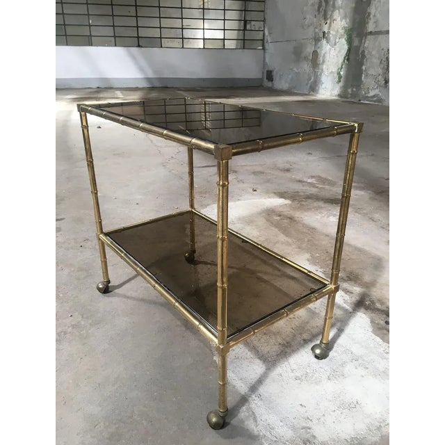 Mid-Century Modern French Gilt Metal & Faux Bamboo Bar Cart with Smoked Glasses by Maison Baguès, 1960s, in Good...