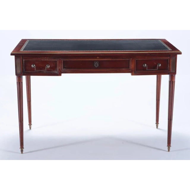 French mahogany Directoire style leather top desk with bronze trim and pull out slides C 1945. Ht: 30.5" Wd: 47" Dpth:...