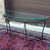 High quality vintage wrought iron demilune glass topped console table featuring a one piece welded frame with rope &...