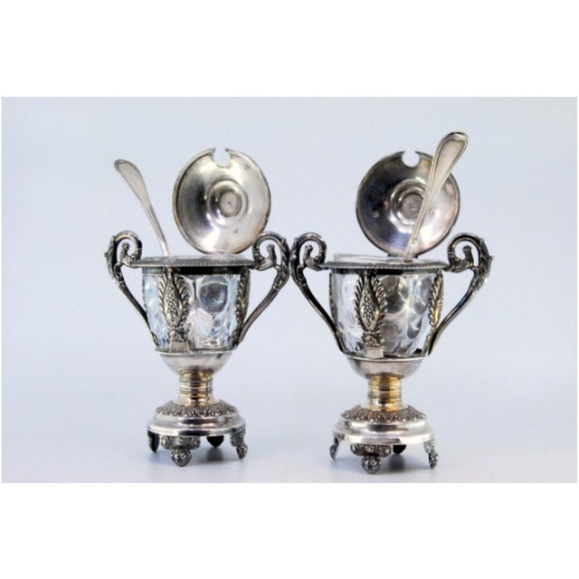 Mustard Pots in Embossed Silver with Palms, Glass Cores and Resting on Claw-Shaped Feet, Set of 2, in Good conditions....