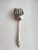 A large silverplate fish serving fork by Christofle, France, bearing the maker's oval "CC" mark (Charles Christofle,...
