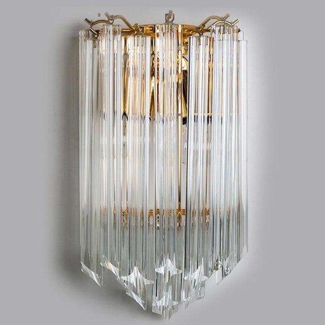 Beautiful tree tear-shaped glass wall sconces featuring eight long crystal clear glass "triete" prism-rods, with brass...