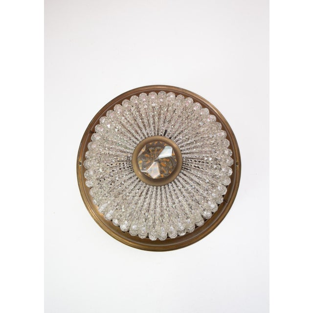 High-quality brass ceiling light with a beautiful patina and Bohemian crystal, dating from the 1920s-30s. It bears the...