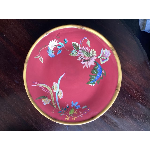 A delicious pop of color for your table. Rich red with florals and bamboo trim. Hand Painted.